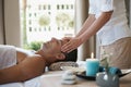 Relax, head massage and man at spa for skincare, peace and calm at luxury resort at table for wellness. Beauty, therapy Royalty Free Stock Photo