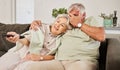 Relax, horror and watching tv with old couple on sofa for streaming, subscription and movie. Fear, television and scared Royalty Free Stock Photo