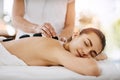 Relax, hot stone and woman getting a back massage at a spa for luxury, calm and natural self care. Beauty, body care and Royalty Free Stock Photo