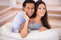 Relax, hug and portrait of happy couple on couch for weekend bonding, romance and connection in home. Love, support and
