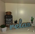 Relax - inspirational word with wooden letters at white background