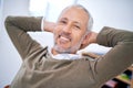 Relax - its Friday. A cropped portrait of a relaxed and carefree businessman sitting at his desk.