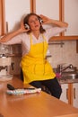 Singing housewife at home Royalty Free Stock Photo