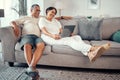 Relax, laptop and elderly couple on sofa, bonding and laughing at funny online video in a living room. Love, retirement Royalty Free Stock Photo