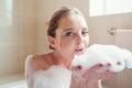 Relax and let your worries just soak away. Portrait of an attractive young woman relaxing in the bathtub. Royalty Free Stock Photo