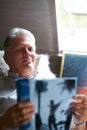 Relax, magazine or senior man reading newspaper articles in home for information or story updates. Smile, book or mature Royalty Free Stock Photo