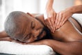 Relax man, spa and back massage for luxury wellness, therapy, healing and skincare. Therapist touch body, muscle and