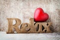 Relax. Message of home with wooden letters