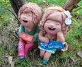 Relax mini boy and girl statuary Royalty Free Stock Photo