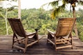 Relax place for couple. Cup coffee on chair.