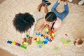 Relax, play and above of children on floor with building blocks for learning, education and child development. Family Royalty Free Stock Photo