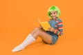 Relax and read book. Adorable small child read book yellow background. Cute little girl enjoy reading. You cant buy Royalty Free Stock Photo