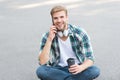 Relax and recharge. Have fun during break. Call friend. Guy carefree student enjoy coffee outdoors. Life balance Royalty Free Stock Photo