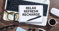 Relax, Refresh, Recharge on notepad Royalty Free Stock Photo