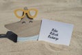 RELAX REFRESH RECHARGE text on paper greeting card on background of funny starfish in glasses summer vacation decor