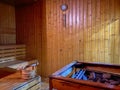 Relax sauna room with wood, heater and stones