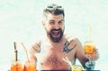 Relax at sea and spa resort. Cocktail party with bearded man in pool. Pool party with hipster in blue water. Man