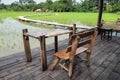 wooden terrace near paddy rice field