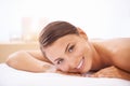 Relax, self care and young woman at spa with body massage for health, wellness and pamper. Happy, natural and female Royalty Free Stock Photo