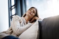 Relax, sleeping woman and living room couch at home with a nap and feeling calm. Sofa, house and lounge of a young Royalty Free Stock Photo