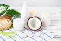 Relax and spa theme. Coconut, coconut oil, milk, candles, massage brush Royalty Free Stock Photo