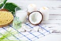 Relax and spa theme. Coconut, coconut oil, milk, candles, massage brush Royalty Free Stock Photo