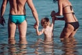 Relax in summer vacation. relax of young family with small boy in sea water. Royalty Free Stock Photo