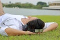 Relax time concept. Young Asian man listening to music with headphone in nature background. Royalty Free Stock Photo