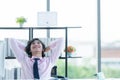 Relax time.  Successful Businessman relaxing  and resting after sitting and hard working in modern office. Royalty Free Stock Photo