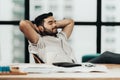 Relax time.  Successful Businessman relaxing  and resting after sitting and hard working in modern office. Royalty Free Stock Photo