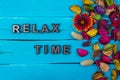 Relax time text on blue wood with flower