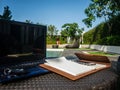 Relax time working area near pool with laptop, notebook and phone Royalty Free Stock Photo