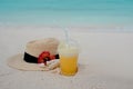 Relax on a tropical island, concept. Protection from sun and heat. Straw hat and pineapple juice Royalty Free Stock Photo
