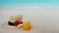 Relax on a tropical island, concept. Protection from sun and heat. Straw hat and pineapple juice Royalty Free Stock Photo