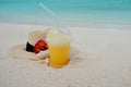 Relax on a tropical island, concept. Protection from sun and heat. Straw hat and pineapple juice Royalty Free Stock Photo