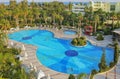 Relax in the Turkish hotel. Large swimming pool, palm trees, park recreation area. Kemer, Turkey