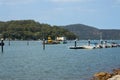 relax view of Houses and Boat Sheds amongst the trees on Hawkesbury River on Sydney Central Coast NSW Australia