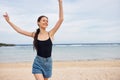 young woman running leisure sea beach summer lifestyle travel smile sunset