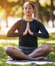 Relax woman, namaste and meditation at park, wellness or freedom of chakra energy, zen fitness or peace. Young girl