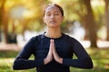 Relax woman, namaste and meditation at park, wellness or freedom of chakra energy, zen fitness or peace. Young girl