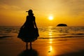 Relax Woman standing  on the beach  sea  Sunset silhouette Royalty Free Stock Photo