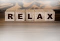 Relax Word Written In Wooden Cubes. Relaxation healthcare concept Royalty Free Stock Photo