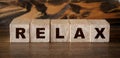 Relax Word Written In Wooden Cubes. Relaxation healthcare concept Royalty Free Stock Photo