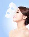 Relax Young woman with cloth facial mask Royalty Free Stock Photo