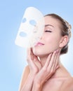 Relax Young woman with cloth facial mask Royalty Free Stock Photo