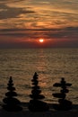 Relax zen stones balanced. Black pebbles at sunrise