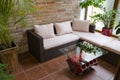 Relax zone in conservatory with table from engine and rattan sofa
