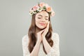 Relaxation and aromatherapy concept.  Pretty young woman with clear skin and flowers relaxing Royalty Free Stock Photo