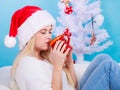 Woman in santa christmas hat drinking tea or coffee Royalty Free Stock Photo