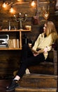 Relaxation concept. Girl student relaxing with book and glass of mulled wine. Girl in casual outfit sits with book in Royalty Free Stock Photo